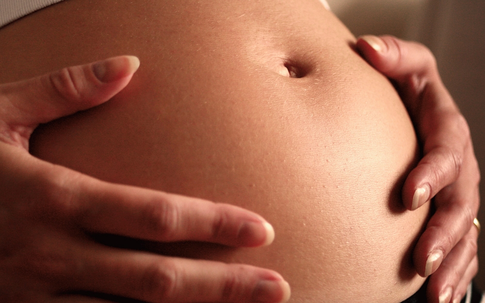 Почему тянет низ живота при беременности?